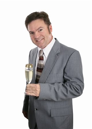 A handsome businessman celebrating with a glass of champagne.  Isolated on white. Stock Photo - Budget Royalty-Free & Subscription, Code: 400-03972271