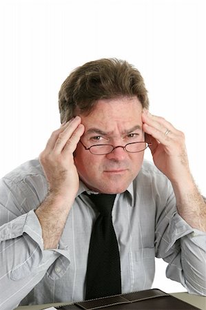 eyeglasses forehead - Businessman suffering with a headache at work.  Isolated on white. Photographie de stock - Aubaine LD & Abonnement, Code: 400-03972287