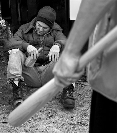 drunk teen - A photo of a homeless man sitting against a dumpster, with a teen holding a bat approaching.  Black & white and film grain effects added for drama. Stock Photo - Budget Royalty-Free & Subscription, Code: 400-03972289