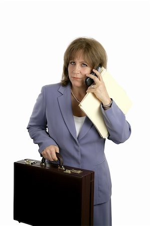 simsearch:400-03972372,k - A pretty, mature business woman trying to do too many things at once and looking frustrated. Stock Photo - Budget Royalty-Free & Subscription, Code: 400-03972363