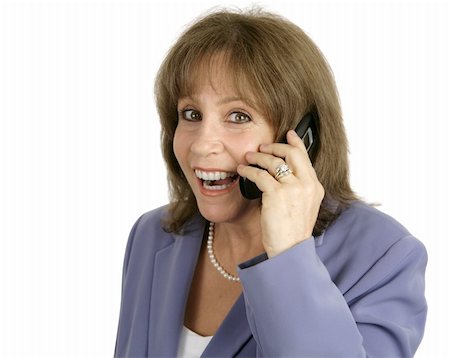An attractive businesswoman very surprised and happy as she talks on her cellphone.  Isolated. Stock Photo - Budget Royalty-Free & Subscription, Code: 400-03972372