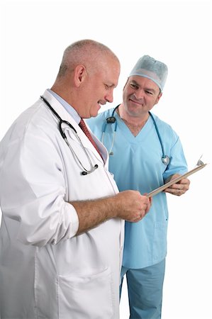 simsearch:400-04217553,k - Two physicians consulting together on a case. Isolated.  (focus on doctor in blue) Foto de stock - Royalty-Free Super Valor e Assinatura, Número: 400-03972400