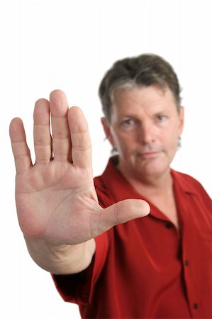 simsearch:400-03972352,k - A handsome, serious man holding his hand up in a stop gesture.  Focus on hand.  Isolated Stock Photo - Budget Royalty-Free & Subscription, Code: 400-03972478