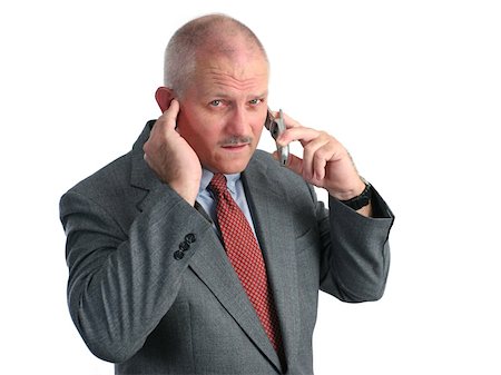 simsearch:400-05347520,k - a man trying to hear his cellphone in a loud place - he looks annoyed Photographie de stock - Aubaine LD & Abonnement, Code: 400-03972470