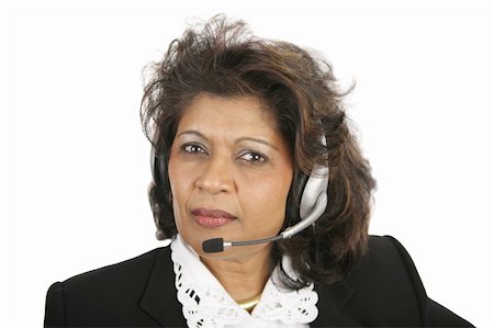 A caring, concerned Indian telephone operator.  Isolated on white. Stock Photo - Budget Royalty-Free & Subscription, Code: 400-03972767