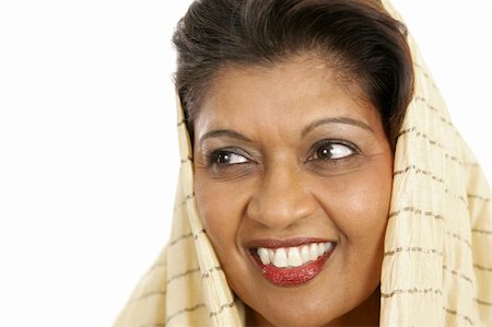 Closeup portrait of a beautiful Indian woman looking away. She has beautiful skin and a beautiful smile. Foto de stock - Royalty-Free Super Valor e Assinatura, Número: 400-03972813