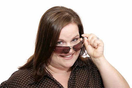 peeping fashion - Beautiful plus sized model flirting by lowering her sunglasses to check you out.  Isolated on white. Stock Photo - Budget Royalty-Free & Subscription, Code: 400-03972832