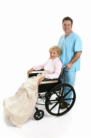 senior sick man full body - Side view of a disabled senior woman being pushed in her wheelchair by a doctor or male nurse.  Full body isolated on white. Foto de stock - Super Valor sin royalties y Suscripción, Código: 400-03973071