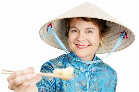Tourist in Chinatown holding a chinese dumpling toward the camera - offering a bite.  Isolated on white. Stock Photo - Budget Royalty-Free & Subscription, Code: 400-03973089