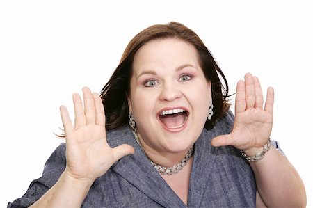 dress for fat women - Beautiful plus sized model holding her hands up in a gesture of surprise.  Isolated on white. Stock Photo - Budget Royalty-Free & Subscription, Code: 400-03973126