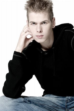 skinny 19 year old man - studio portrait of a young man pouting Stock Photo - Budget Royalty-Free & Subscription, Code: 400-03973426