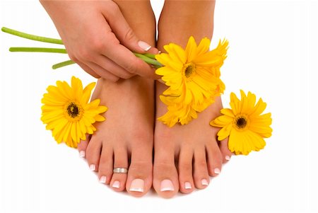 Pedicured feet, manicured hand and gerbera daisies Foto de stock - Royalty-Free Super Valor e Assinatura, Número: 400-03973517