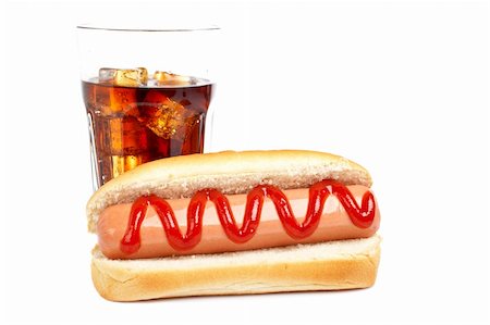 A hot dog and soda glass, reflected on white background. Shallow DOF Stock Photo - Budget Royalty-Free & Subscription, Code: 400-03973850
