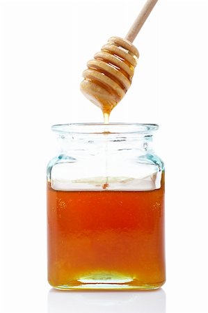 simsearch:400-08013853,k - Pouring honey on glass jar, on white background Stock Photo - Budget Royalty-Free & Subscription, Code: 400-03984145