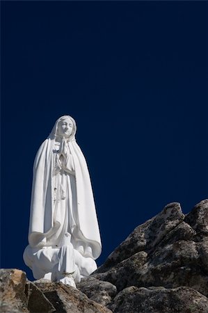 Statue of the Virgin Mary (Our Lady of Fatima) with deep blue sky. Stock Photo - Budget Royalty-Free & Subscription, Code: 400-03984152
