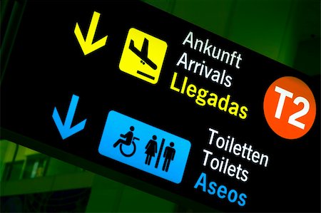 Arrivals and toilets sign panels in airport, Malaga. Stock Photo - Budget Royalty-Free & Subscription, Code: 400-03984331