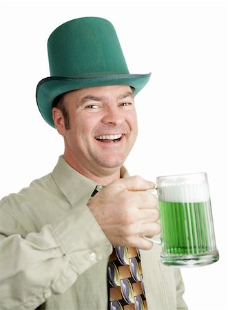Man of Irish heritage enjoying a green beer on St. Patrick's Day and singing a drinking song.  Isolated on white. Stock Photo - Budget Royalty-Free & Subscription, Code: 400-03985231