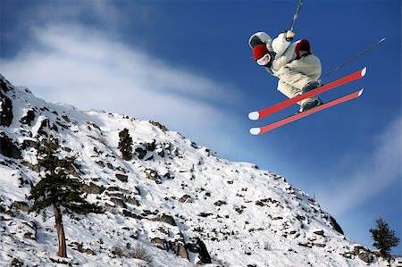 simsearch:400-04811318,k - A young man jumping high at Lake Tahoe resort Stock Photo - Budget Royalty-Free & Subscription, Code: 400-03985468