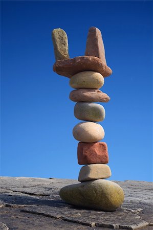 Column of balanced boulders against blue sky Stock Photo - Budget Royalty-Free & Subscription, Code: 400-03986051