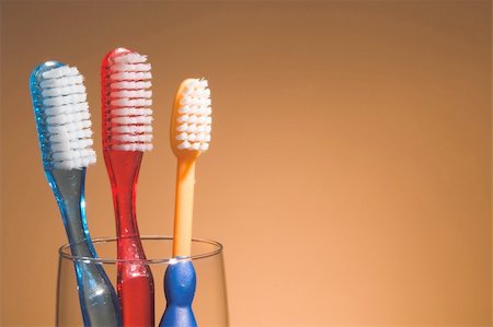 dentist, family - A family's toothbrushes in a glass container. Stock Photo - Budget Royalty-Free & Subscription, Code: 400-03986156