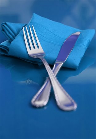restaurant in blue with table setting - A bright and colorful table setting in blue Stock Photo - Budget Royalty-Free & Subscription, Code: 400-03986547