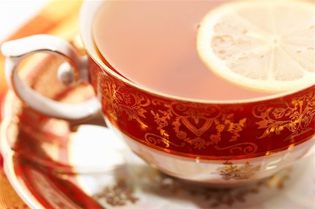 macro pic of a red cup of tea with lemon Stock Photo - Budget Royalty-Free & Subscription, Code: 400-03986576