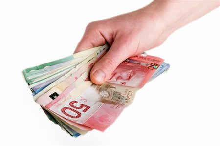 simsearch:695-05780265,k - A hand full of Canadian Cash Photographie de stock - Aubaine LD & Abonnement, Code: 400-03986747