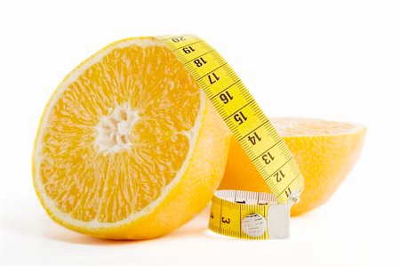 simsearch:400-03986789,k - A freshly cut orange with a measuring tape. Photographie de stock - Aubaine LD & Abonnement, Code: 400-03986824