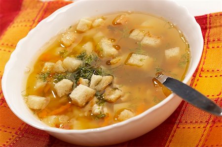 soup and crackers - macro picture of appetizing pea soup with crouton Stock Photo - Budget Royalty-Free & Subscription, Code: 400-03986840