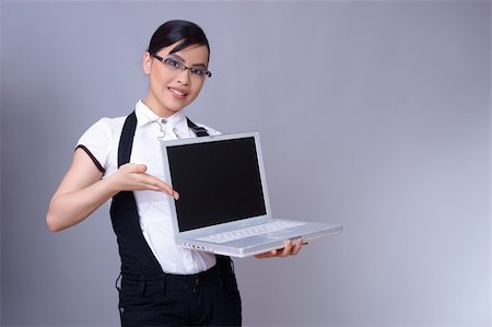simsearch:400-03954172,k - Beautiful brunette business woman with laptop computer Stock Photo - Budget Royalty-Free & Subscription, Code: 400-03987321