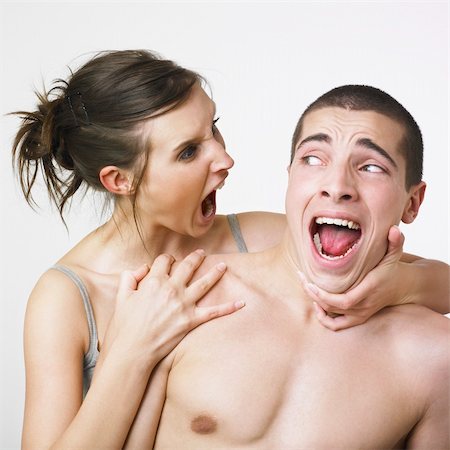 Young couple making strange faces at each other Foto de stock - Super Valor sin royalties y Suscripción, Código: 400-03987758