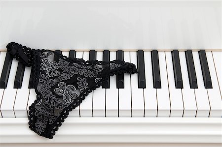 Pair of ladies lace panties on the keyboard of a white baby grand piano. Photographie de stock - Aubaine LD & Abonnement, Code: 400-03987933