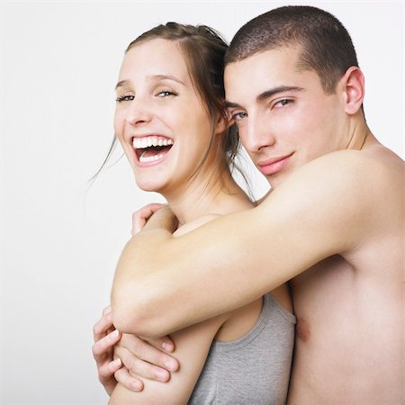 A young man hugging a young woman. Stock Photo - Budget Royalty-Free & Subscription, Code: 400-03988436