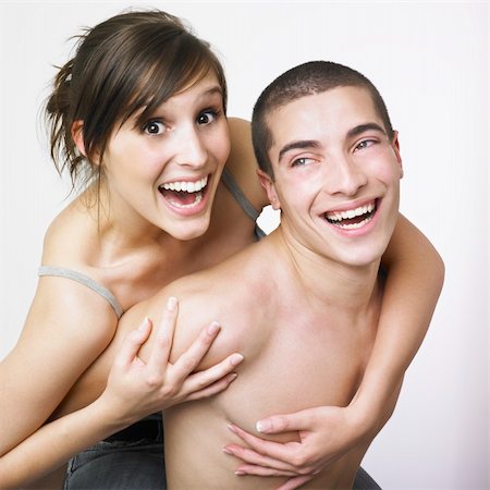A young man and woman hugging each other and smiling. Stock Photo - Budget Royalty-Free & Subscription, Code: 400-03988443