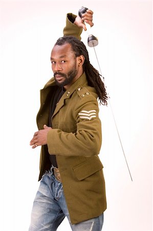 simsearch:693-03363711,k - A Black man in a Army jacket with a sword isolated on a white background. Stockbilder - Microstock & Abonnement, Bildnummer: 400-03989134