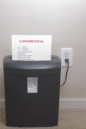 A shredder with confidential information - Identity theft concept. Stock Photo - Budget Royalty-Free & Subscription, Code: 400-03989131