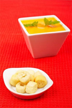 simsearch:400-07092695,k - Bread croutons and carrots puree and parsley on red mat. Shallow DOF Photographie de stock - Aubaine LD & Abonnement, Code: 400-03989441