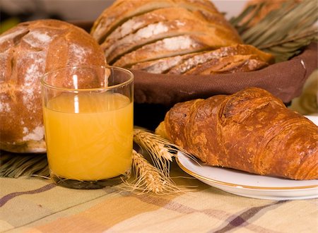 simsearch:400-03932840,k - Rustic various baked bread with orange juice Stock Photo - Budget Royalty-Free & Subscription, Code: 400-03989461