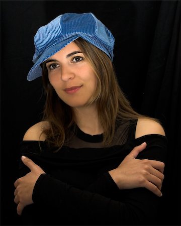 simsearch:400-03972104,k - Beautiful woman portrait with a blue cap Photographie de stock - Aubaine LD & Abonnement, Code: 400-03989611