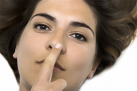 simsearch:400-04001073,k - Young woman with the finger on the nose Photographie de stock - Aubaine LD & Abonnement, Code: 400-03989613