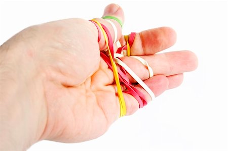 simsearch:400-07167932,k - A male hand tangled in a mess of rubber bands.  Isolated on white with clipping path. Foto de stock - Super Valor sin royalties y Suscripción, Código: 400-03983626