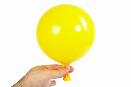 person holding up mask - A yellow baloon being held in a hand.  Isolated on white with clipping path. Stock Photo - Budget Royalty-Free & Subscription, Code: 400-03983627