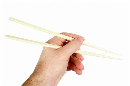 A males hand using chopsticks, isolated on white with clipping path. Stock Photo - Budget Royalty-Free & Subscription, Code: 400-03983634
