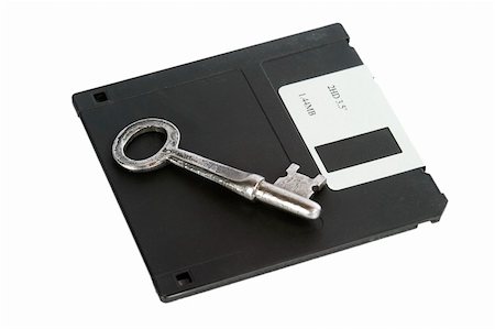 driving skeleton - A skeleton key and a 3 1/2" computer disk, isolated on white with clipping path. Stock Photo - Budget Royalty-Free & Subscription, Code: 400-03983644