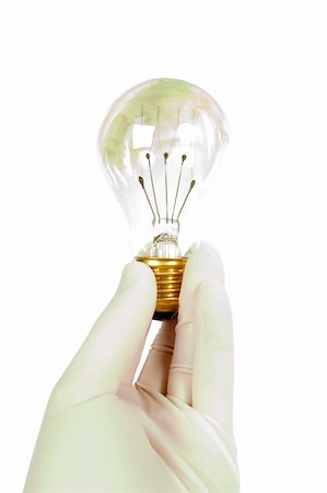 rubber hand gloves - A mans hand wearing a latex glove holding a light bulb, isolated on white with clipping path. Stock Photo - Budget Royalty-Free & Subscription, Code: 400-03983640