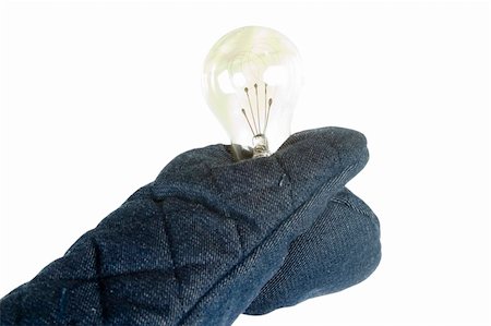 pot holder - A light bulb being held by an oven mitt.  Isolated on white with clipping path. Stock Photo - Budget Royalty-Free & Subscription, Code: 400-03983658