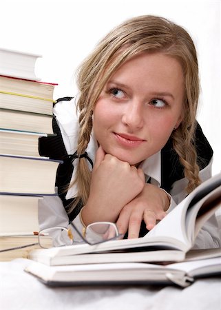 seminary - Schoolgirl or student reading books. Interesting books. She is happy. Isolated on white. Stock Photo - Budget Royalty-Free & Subscription, Code: 400-03983940