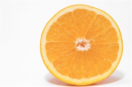 A cross section of a fresh and juicy orange. Stock Photo - Budget Royalty-Free & Subscription, Code: 400-03994005