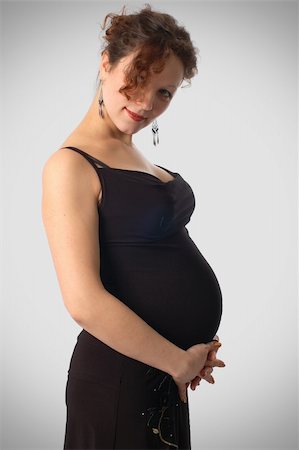 pregnant woman breast - beautiful pregnant woman in  black classic dress Stock Photo - Budget Royalty-Free & Subscription, Code: 400-03994584