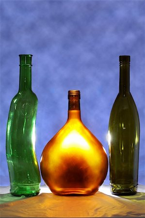three bottles of vine one of them is lighted Photographie de stock - Aubaine LD & Abonnement, Code: 400-03994601